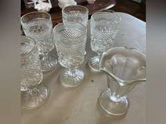 8 Heavy stemmed drinking glasses and 3 sundae glasses.