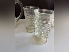 Very heavy glass pitcher with 12 matching stemmed glasses.