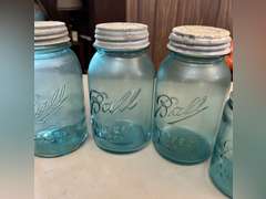 Blue Ball jars with metal caps and 1 clear Mason jar, no lid.