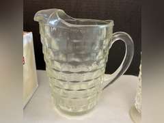 Very heavy glass pitcher with 12 matching stemmed glasses.