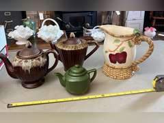 2 Brown Drip glaze tea pots, 1 mini green teapot and 1 decorative pitcher.