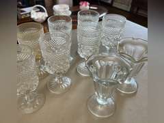 8 Heavy stemmed drinking glasses and 3 sundae glasses.