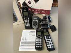 Unidentified cordless telephone in unopened box and Panasonic Link2Cell Cordless phone w/answering machine and 2 additional handsets.
