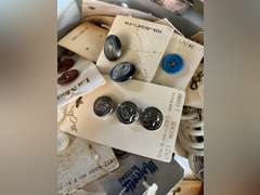 Bread box full of buttons.