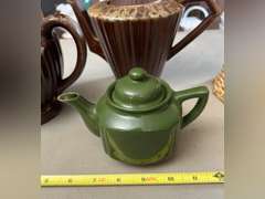 2 Brown Drip glaze tea pots, 1 mini green teapot and 1 decorative pitcher.