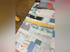 Vintage quilt with feather pillow. Quilt is 82” x 76”.
