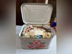 Bread box full of buttons.