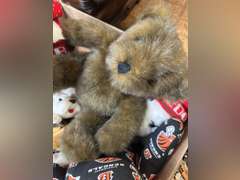 Two boxes with stuffed animals and kids toys