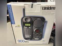 Unidentified cordless telephone in unopened box and Panasonic Link2Cell Cordless phone w/answering machine and 2 additional handsets.