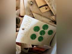 Bread box full of buttons.