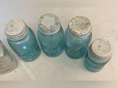 Blue Ball jars with metal caps and 1 clear Mason jar, no lid.