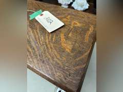 Tucker Oakwood stool, 10 1/2 half inches tall by 15 inches wide by 10 1/2 inches deep
