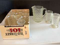 Very heavy glass pitcher with 12 matching stemmed glasses.