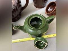 2 Brown Drip glaze tea pots, 1 mini green teapot and 1 decorative pitcher.