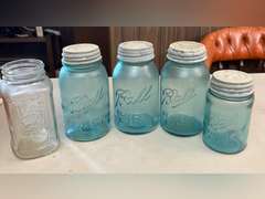 Blue Ball jars with metal caps and 1 clear Mason jar, no lid.