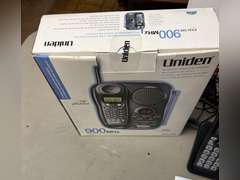 Unidentified cordless telephone in unopened box and Panasonic Link2Cell Cordless phone w/answering machine and 2 additional handsets.
