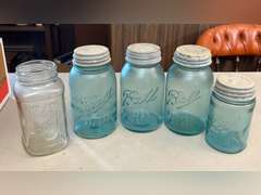 Blue Ball jars with metal caps and 1 clear Mason jar, no lid.