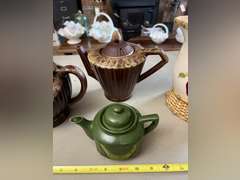 2 Brown Drip glaze tea pots, 1 mini green teapot and 1 decorative pitcher.