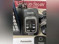 Unidentified cordless telephone in unopened box and Panasonic Link2Cell Cordless phone w/answering machine and 2 additional handsets.