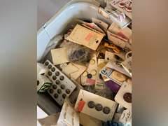 Bread box full of buttons.