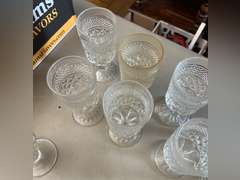 8 Heavy stemmed drinking glasses and 3 sundae glasses.