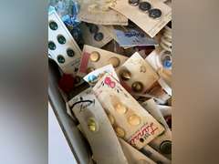 Bread box full of buttons.