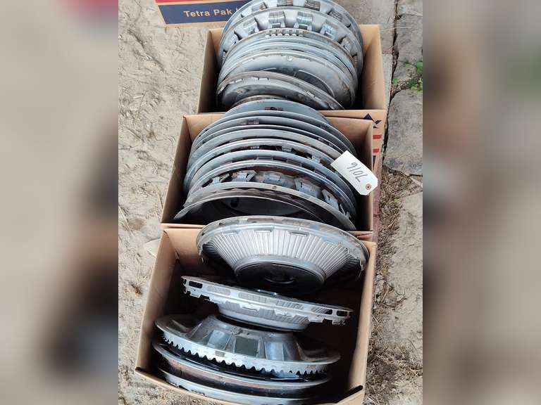 Three boxes of hubcaps and beauty rings - Northern Kentucky Auction, LLC