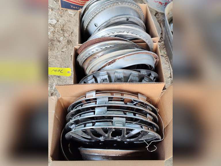 Three boxes of hubcaps and beauty rings - Northern Kentucky Auction, LLC