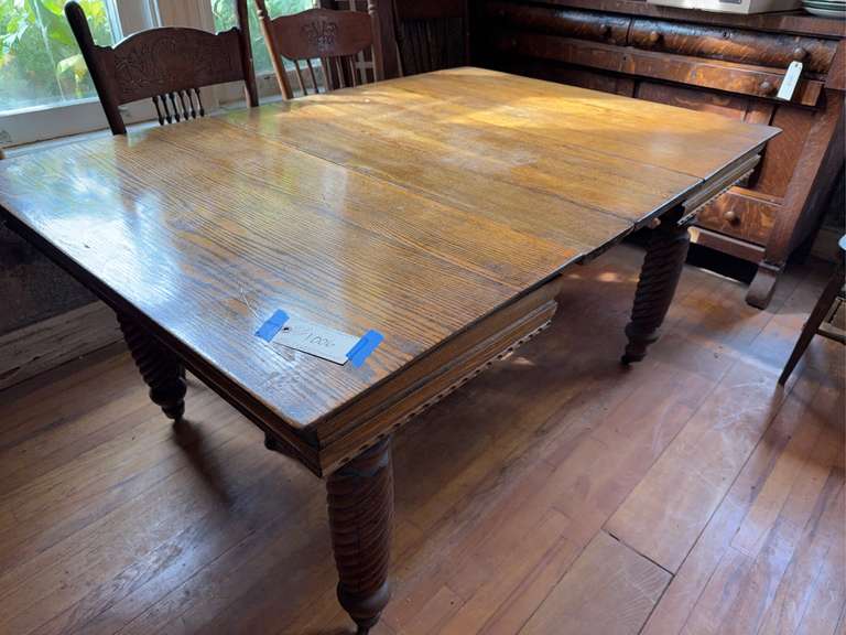 Oak Dining table with spiral carved legs. Needs some repairs.  No chairs included. Multiple leaves included.