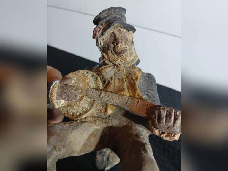 Figurine Playing Banjo