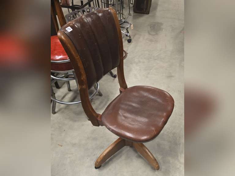 Antique rolling spin around chair, leather covered
