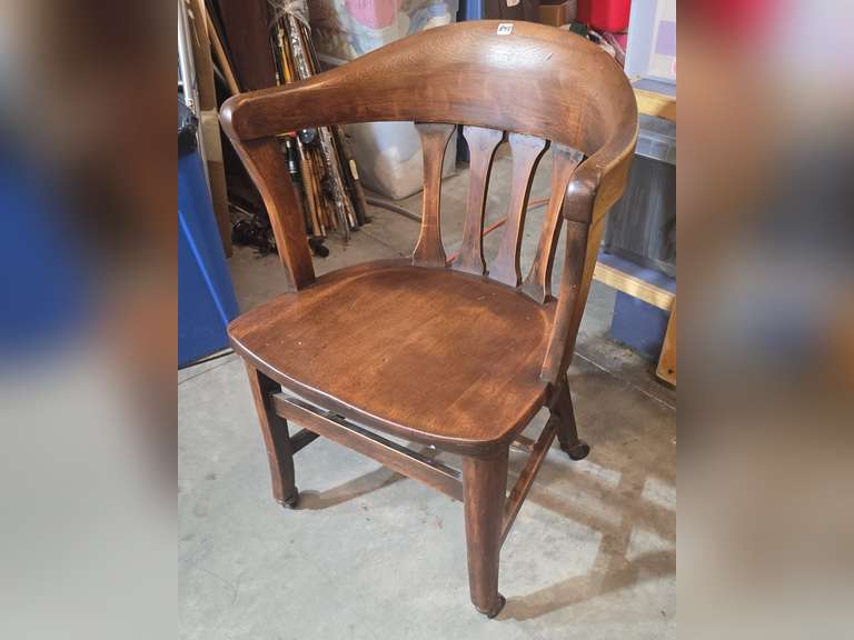 Antique office chair on metal casters