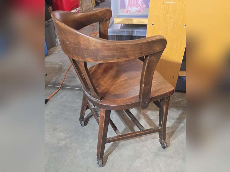Antique office chair on metal casters