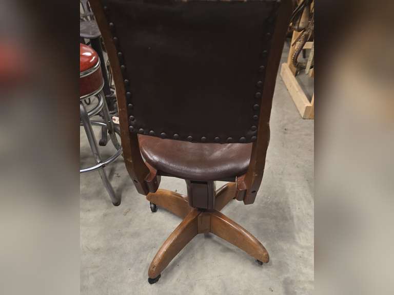 Antique rolling spin around chair, leather covered