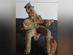 Figurine Playing Banjo