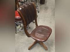 Antique rolling spin around chair, leather covered