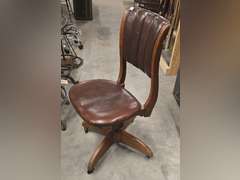 Antique rolling spin around chair, leather covered