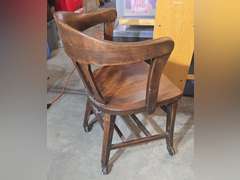 Antique office chair on metal casters