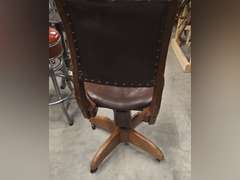 Antique rolling spin around chair, leather covered