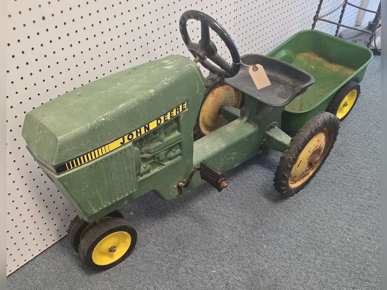 Crittenden room 2. 50+ Years of Collecting, Vintage John Deere Pedal Tractor with cart, All Original Condition, Wicker Rocking Chair, Gossip Bench, Antique HighChair/Stroller, Stoddard Implement Seat, Longaberger, Fenton, Artificial Flowers, Tools, Albums, 45s, Husqvarna Serger, Cast Iron, Crafting/Wine Bottles and More, Banks, Hull Pottery, Paper Mache Pictures, Dooney & Bourke, And Much, Much More