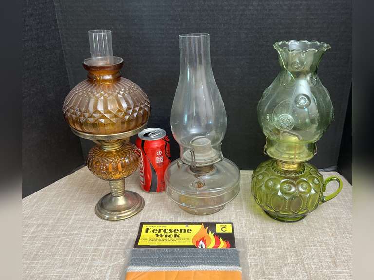 3 Oil lamps. Spout is broke on one and the shade is cracked on the green one. Package of wicks.