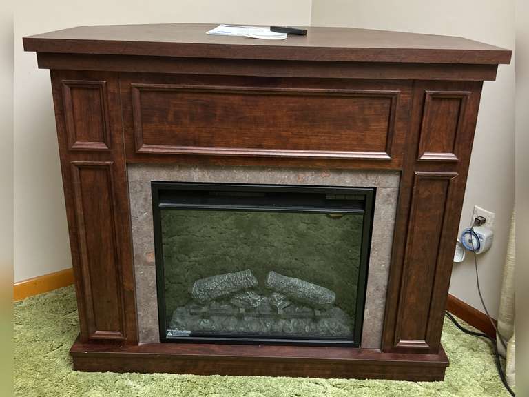 Hampton Bay Granville Electric Fireplace. Has use and care guide with remote. Tested working. See tag for dimensions.