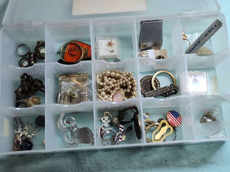 Plastic organizer with miscellaneous jewelry, keychain and other items