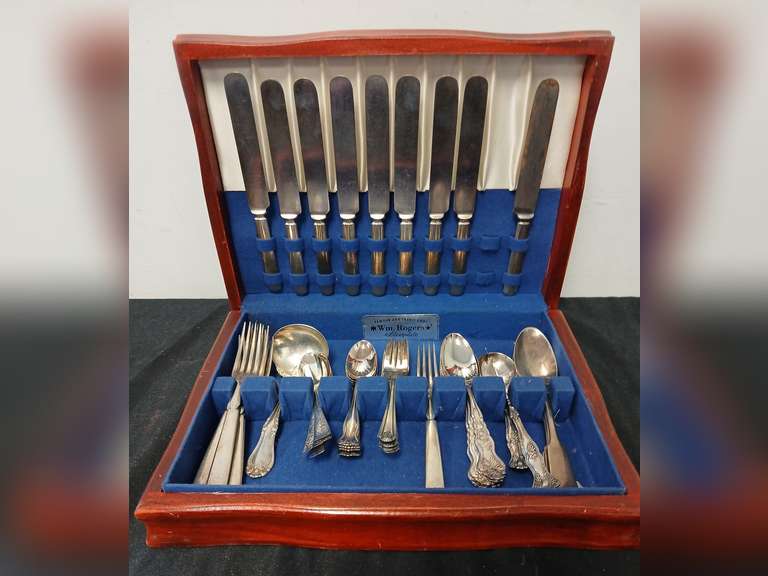 45 Pieces of various brand silverplate flatware in Wm. Rogers chest