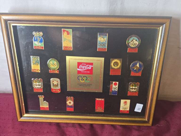 Framed Coca-Cola pins, approximately  10x14.