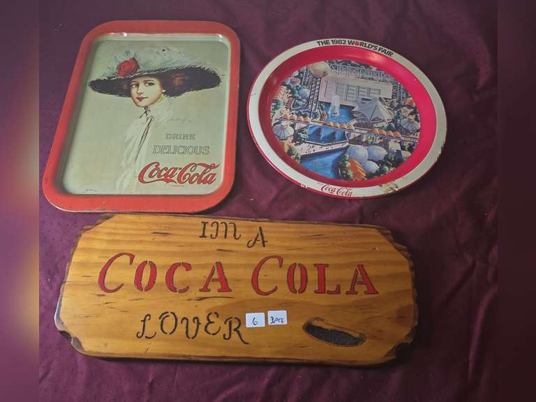 2 Coca-Cola trays and wooden sign