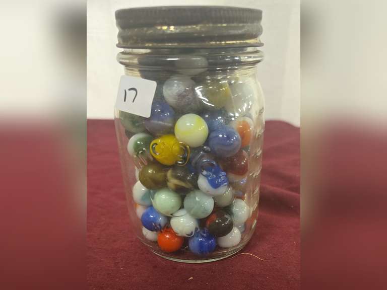 Pint jars of marbles,  some uranium.