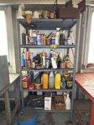Metal cabinet with contents, including motor oil, starting fluid and lubricants