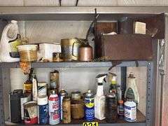 Metal cabinet with contents, including motor oil, starting fluid and lubricants
