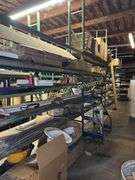 Warehouse shelving with contents (3 rows) 96' (not including metal pipe) buyer responsible for disassembly and removal